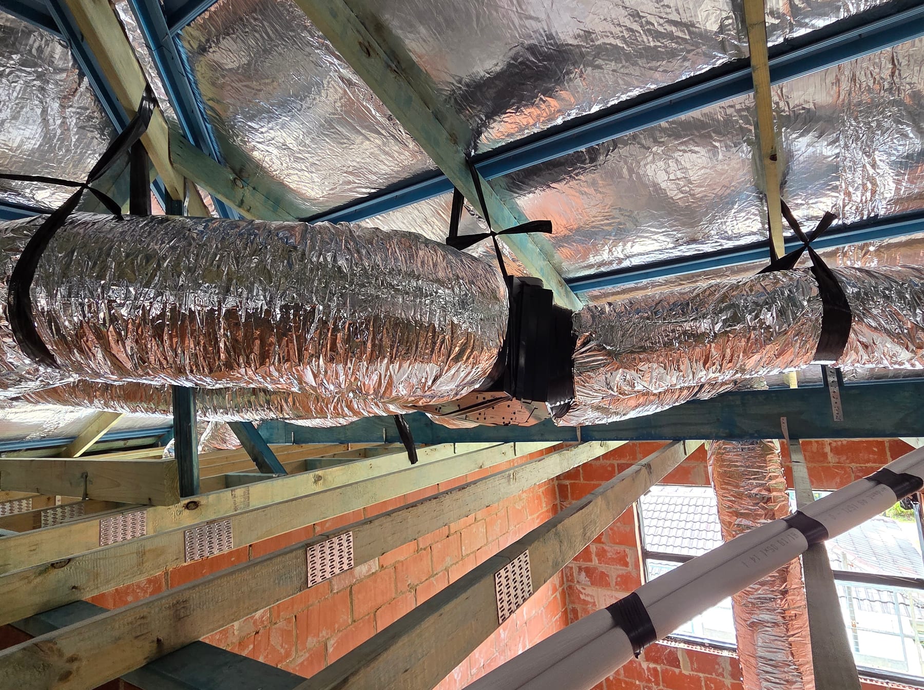 installing ducted system — Otter Air, Perth