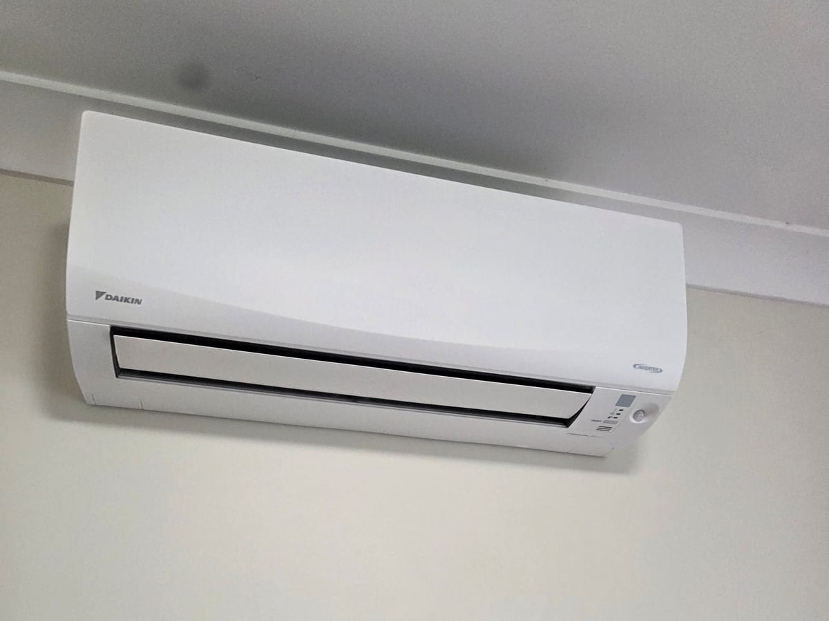 Compact Daikin split system indoor unit installed by Otter Air in a Perth bedroom