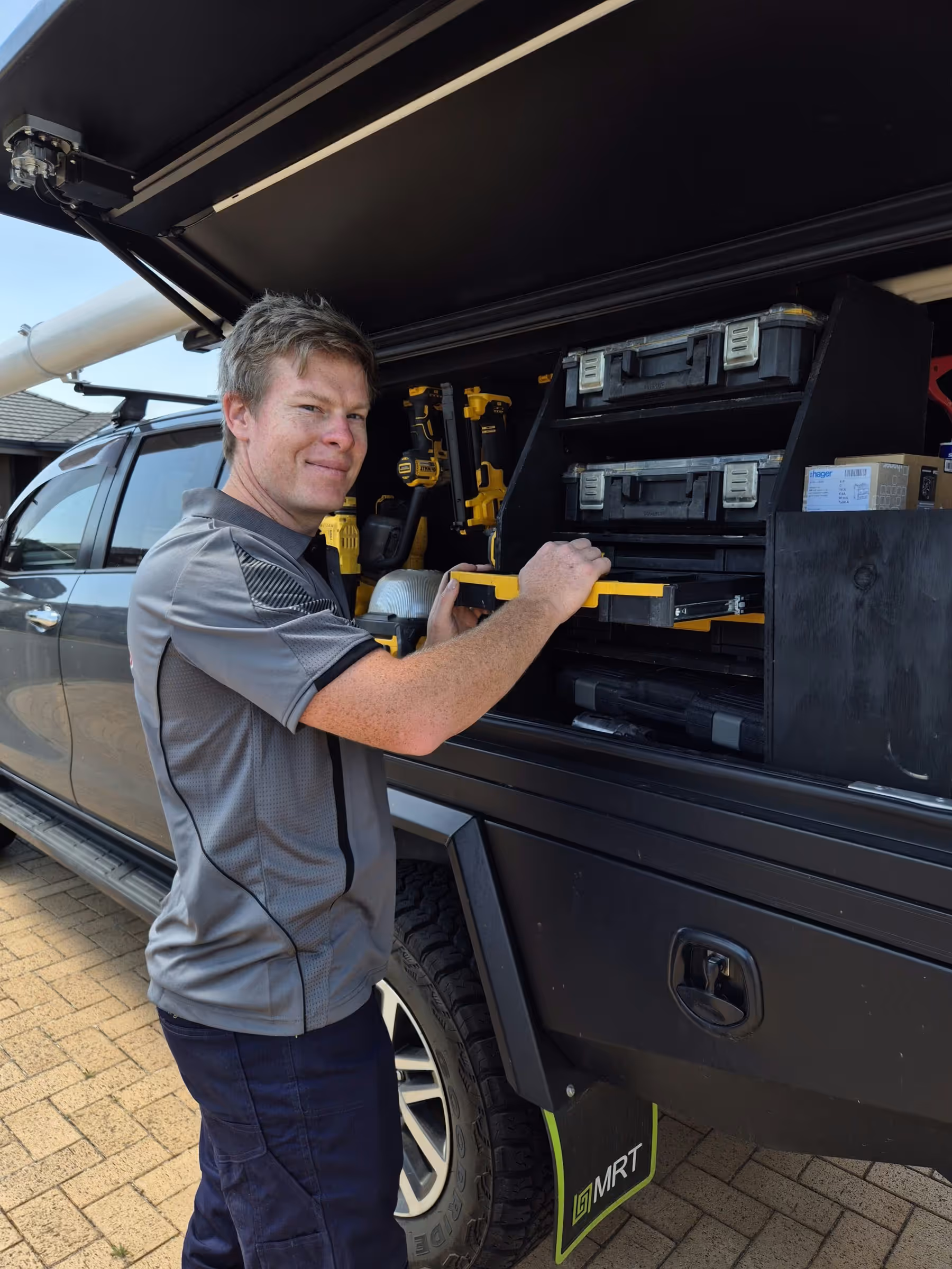 Otter Air technician at the work ute ready for an installation