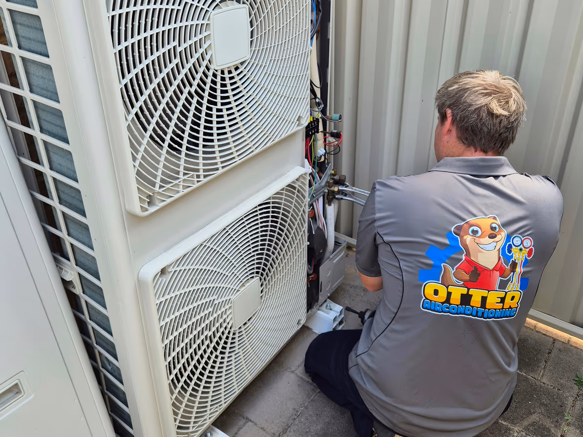 Matt from Otter Air servicing an air conditioning unit