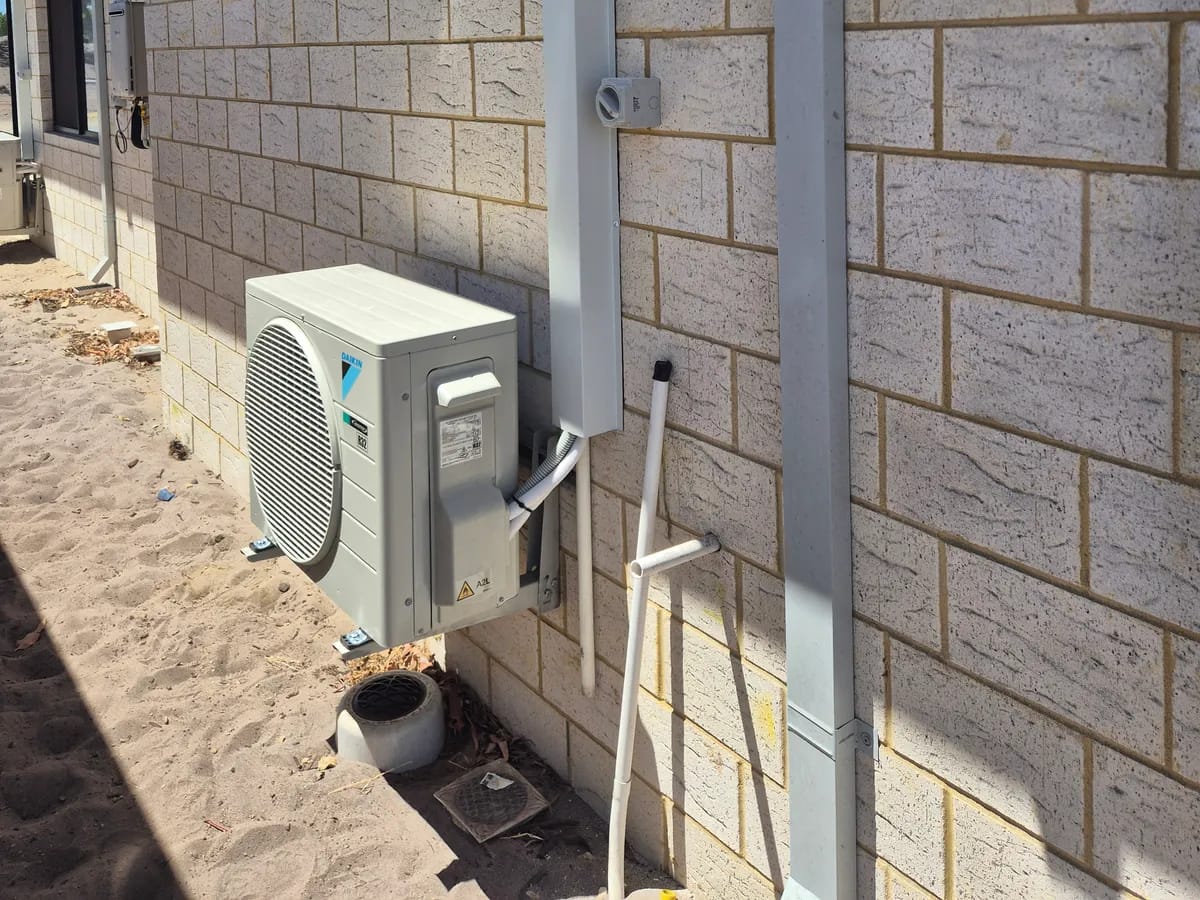 Split system outdoor unit with neat concealed pipework in Perth — one outdoor unit can run a multi-head system — Otter Air